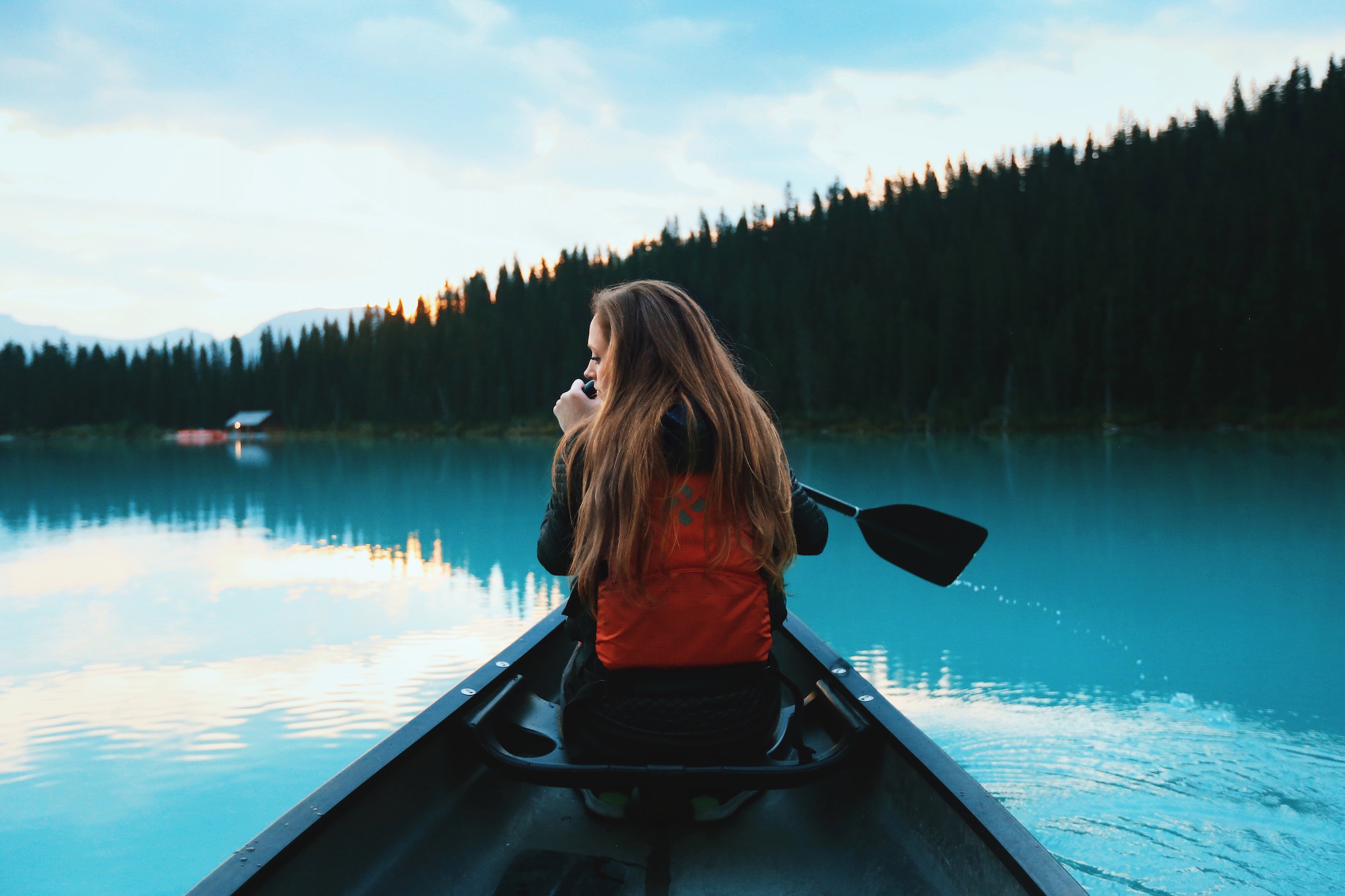 A person kayaking in a lake